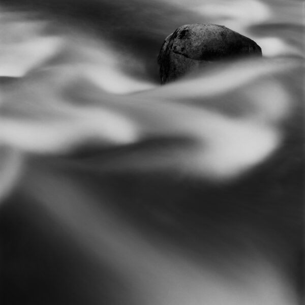 Stationary Rock in flowing water